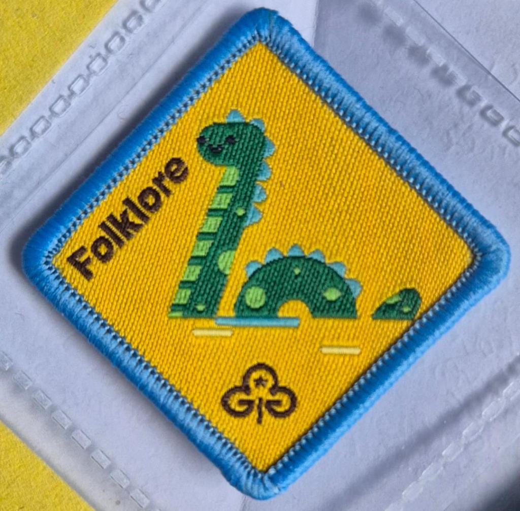 Brownie Folklore Badge, blue binding. Loch Ness Monster logo