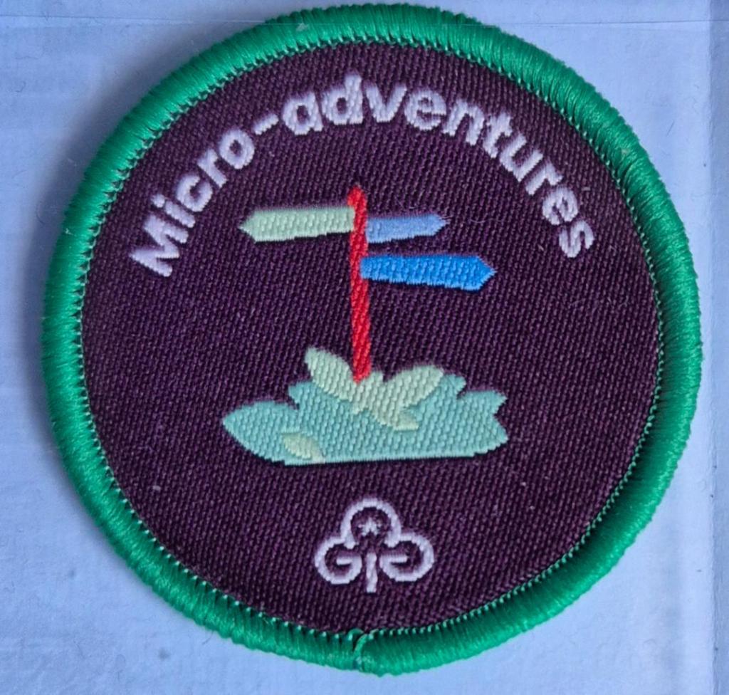 Ranger Micro-Adventures badge, green binding.  Fingerpost logo.