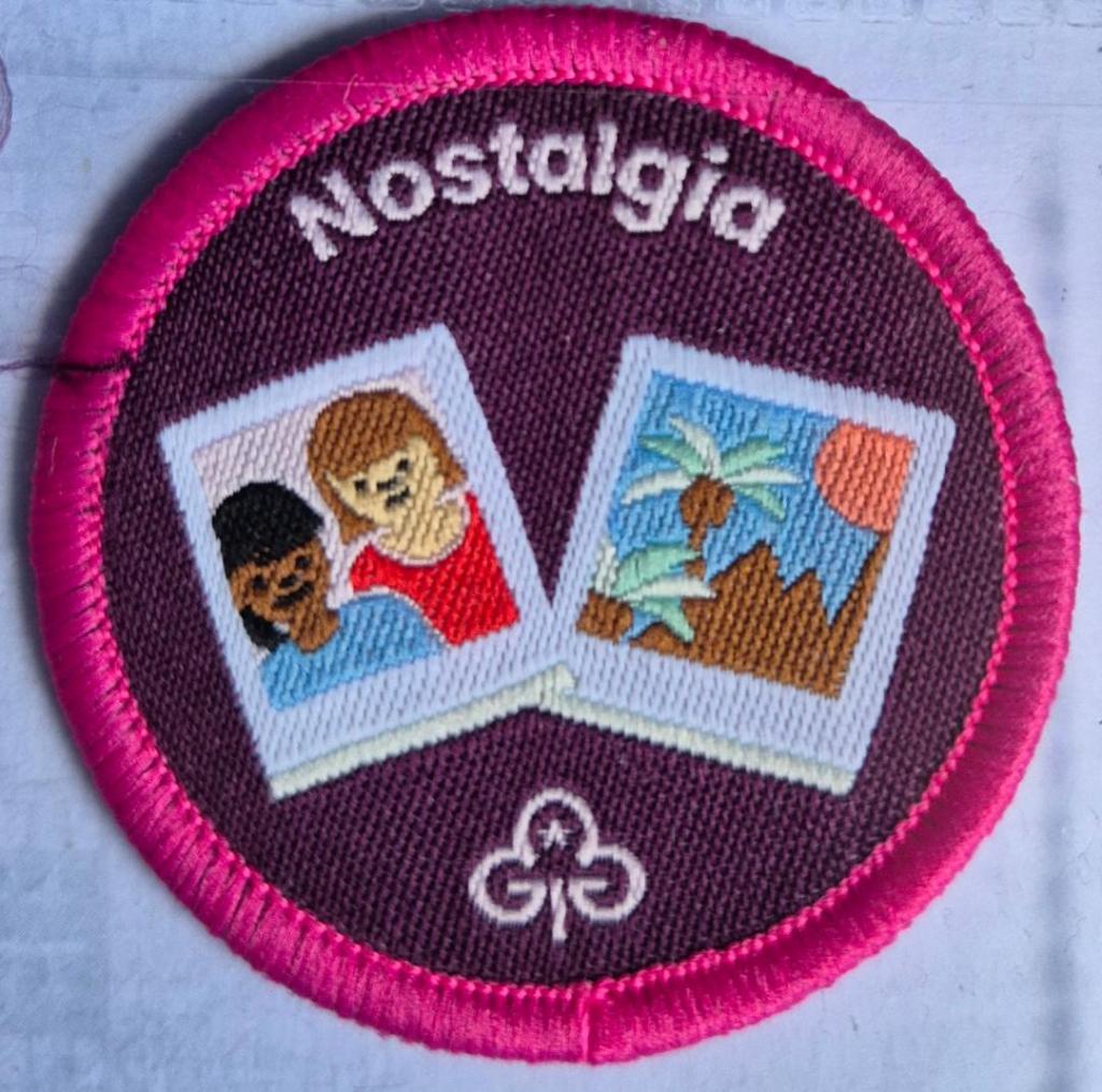 Ranger Nostalgia badge, dark pink binding.  Two photographs logo.