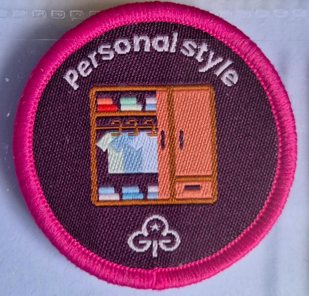 Ranger Personal Style badge, dark pink binding.  Open wardrobe logo.